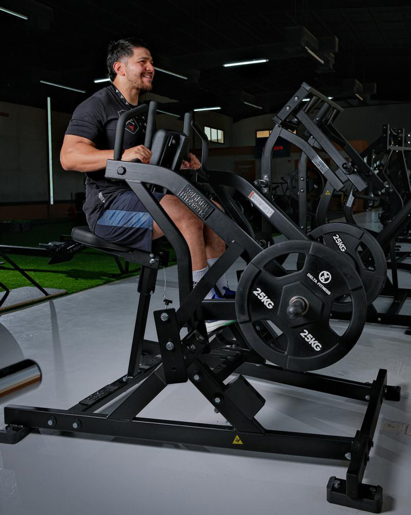 personal trainer working out on upperbody machine